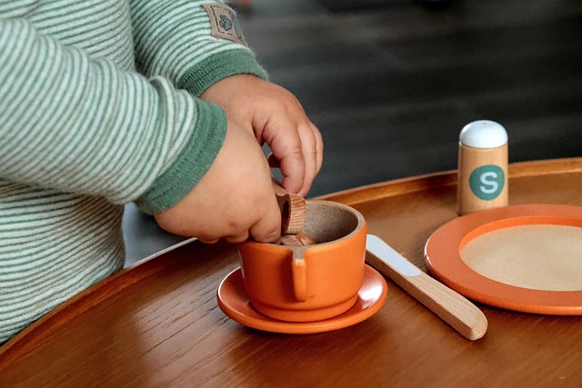 A calm cat interacting positively with a new toy.